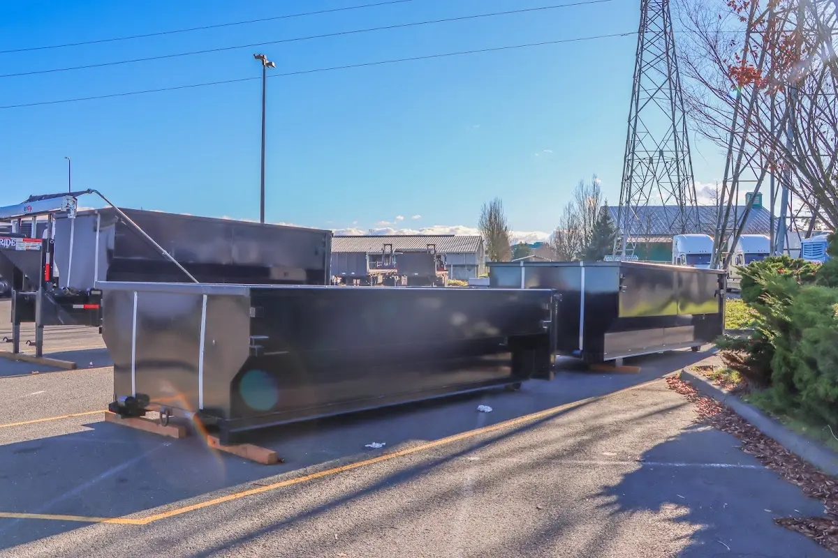 Roll-off dumpster ready for waste disposal at job site for 8 Yard Dumpster Rental in Bedford